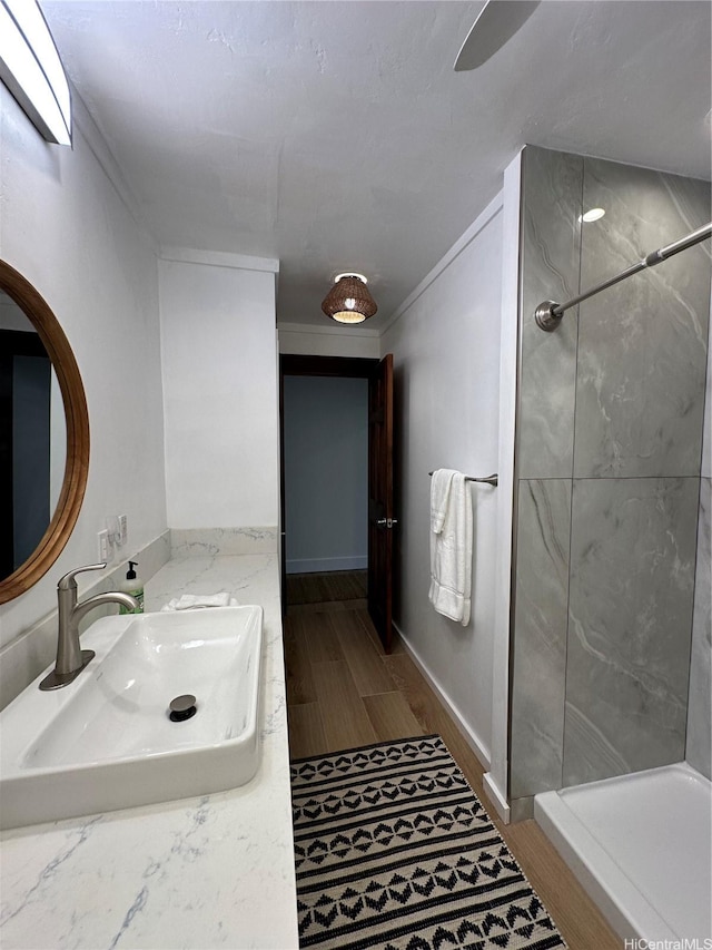 57-68 Eleku Kuilima Pl Unit 657, Kahuku, HI 96731 - full bathroom featuring a walk in shower, vanity, and wood finished floors