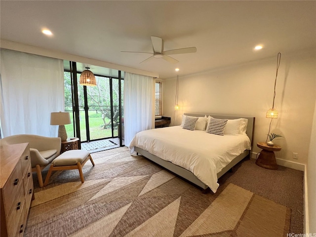 57-68 Eleku Kuilima Pl Unit 657, Kahuku, HI 96731 - carpeted bedroom featuring access to outside, a wall of windows, recessed lighting, and a ceiling fan