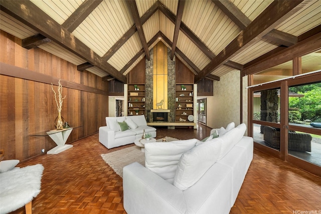 46-478 Haiku Plantations Dr, Kaneohe, HI 96744 - living area featuring wood walls, beam ceiling, built in shelves, a fireplace, and high vaulted ceiling