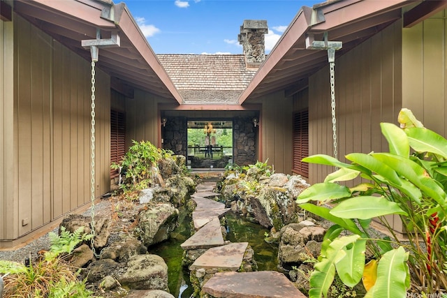 46-478 Haiku Plantations Dr, Kaneohe, HI 96744 - entrance to property with a chimney and stone siding