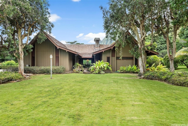 46-478 Haiku Plantations Dr, Kaneohe, HI 96744 - view of front facade with a chimney and a front lawn