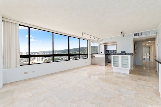 2499 Kapiolani Blvd Unit 2708, Honolulu, HI 96826 - unfurnished living room with track lighting