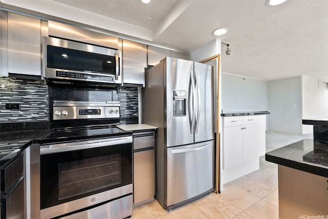 2499 Kapiolani Blvd Unit 2708, Honolulu, HI 96826 - kitchen with appliances with stainless steel finishes, backsplash, recessed lighting, light tile patterned flooring, and dark stone counters