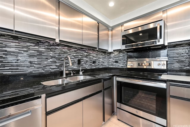 2499 Kapiolani Blvd Unit 2708, Honolulu, HI 96826 - kitchen with appliances with stainless steel finishes, decorative backsplash, and dark stone counters
