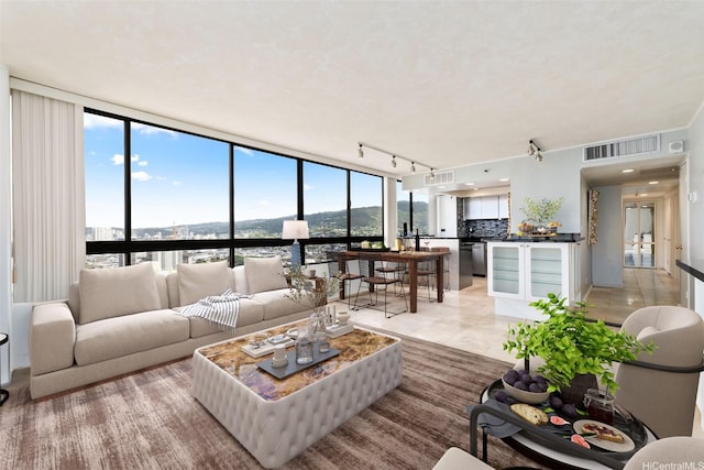 2499 Kapiolani Blvd Unit 2708, Honolulu, HI 96826 - living area with track lighting and a water view