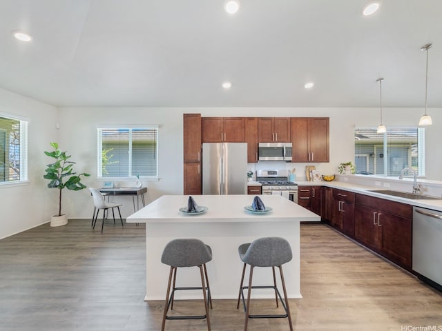 91-1512 Ulaula Loop, Ewa Beach, HI 96706 - kitchen with stainless steel appliances, plenty of natural light, light wood finished floors, and recessed lighting