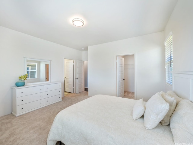 91-1512 Ulaula Loop, Ewa Beach, HI 96706 - bedroom with multiple windows, light colored carpet, and a walk in closet