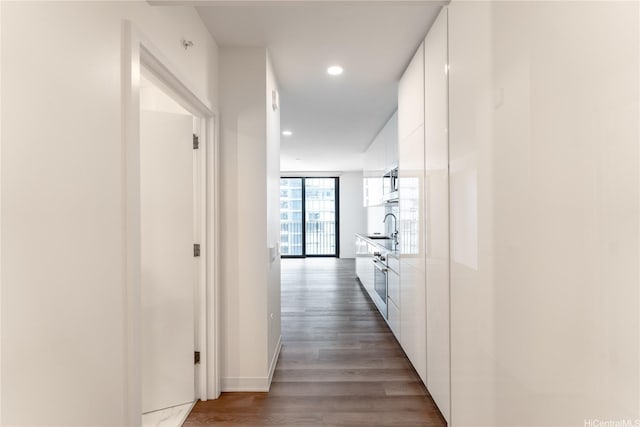 987 Queen St Unit 2308, Honolulu, HI 96814 - hallway with dark wood-style flooring and recessed lighting