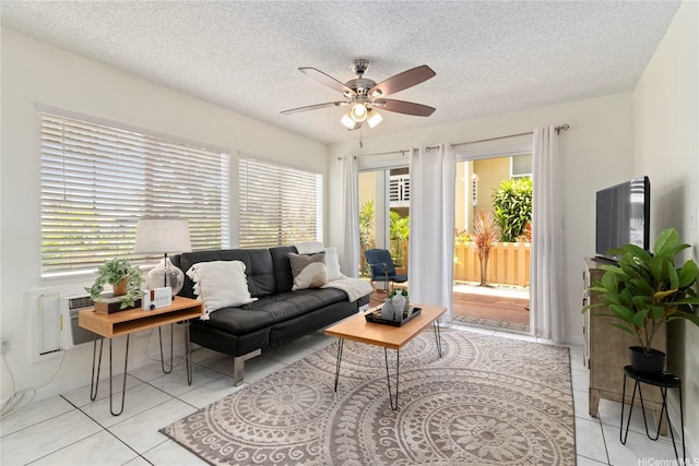 94-496 Kupuohi St Unit 2102, Waipahu, HI 96797 - living area featuring ceiling fan, tile patterned floors, and a textured ceiling
