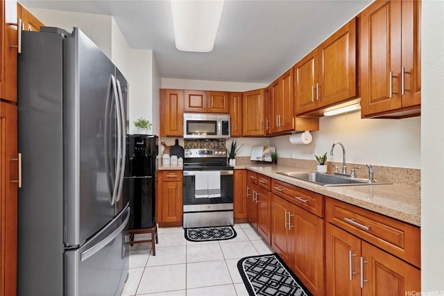 94-496 Kupuohi St Unit 2102, Waipahu, HI 96797 - kitchen with appliances with stainless steel finishes, brown cabinets, light tile patterned floors, and light stone counters