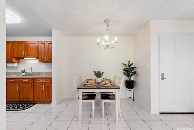 94-496 Kupuohi St Unit 2102, Waipahu, HI 96797 - dining room with a chandelier, a textured ceiling, and light tile patterned floors