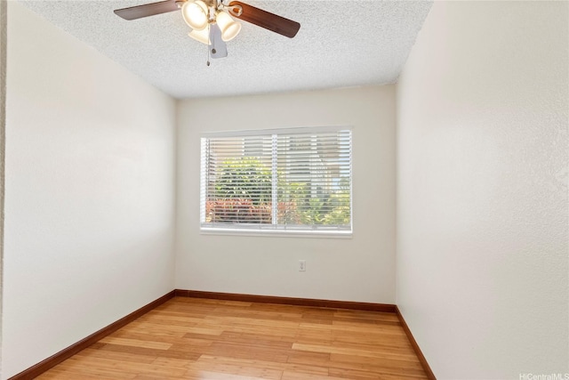 94-496 Kupuohi St Unit 2102, Waipahu, HI 96797 - empty room featuring a textured ceiling, a ceiling fan, and light wood-style flooring
