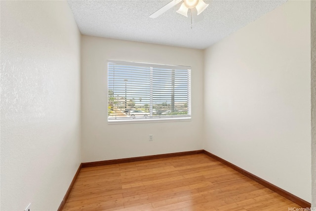 94-496 Kupuohi St Unit 2102, Waipahu, HI 96797 - spare room with light wood-style floors, ceiling fan, and a textured ceiling