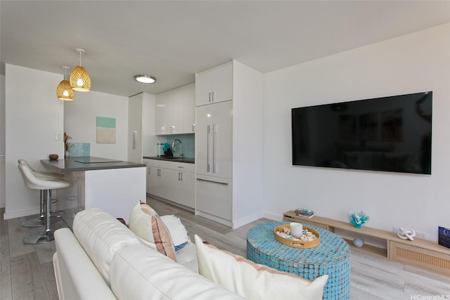 320 Liliuokalani Ave Unit 602, Honolulu, HI 96815 - living area featuring light wood-style flooring and baseboards