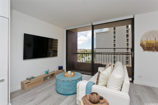320 Liliuokalani Ave Unit 602, Honolulu, HI 96815 - living area with wood finished floors and a wall of windows