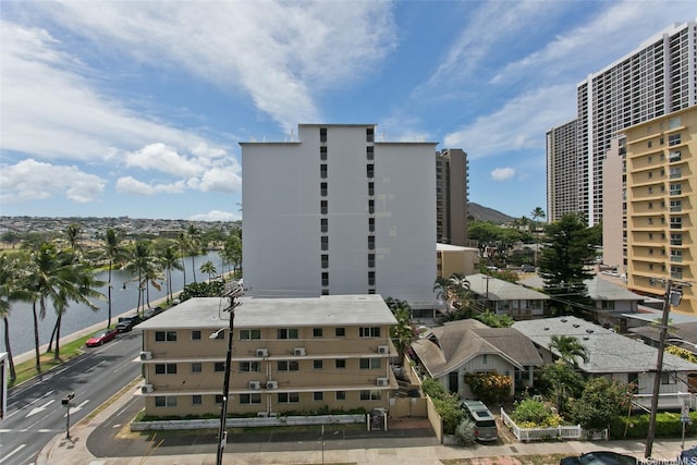 320 Liliuokalani Ave Unit 602, Honolulu, HI 96815 - view of building exterior featuring a water view and uncovered parking