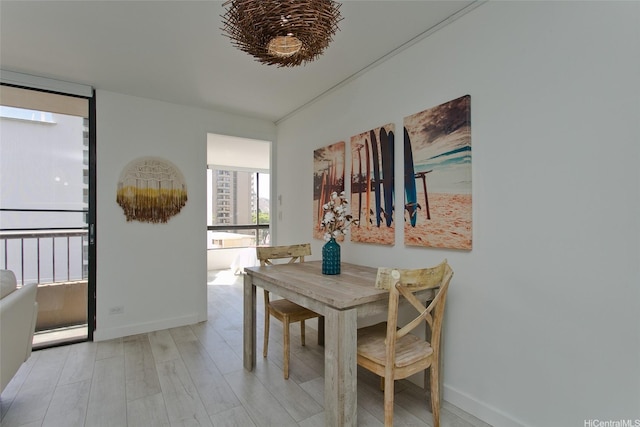 320 Liliuokalani Ave Unit 602, Honolulu, HI 96815 - dining area with baseboards and wood finished floors