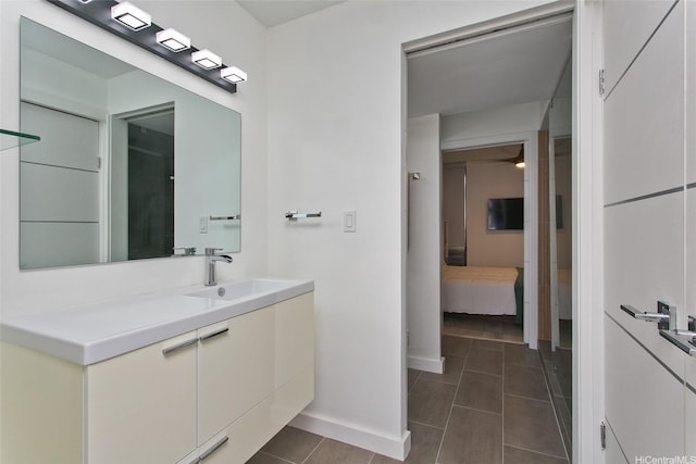 320 Liliuokalani Ave Unit 602, Honolulu, HI 96815 - bathroom with vanity and tile patterned flooring