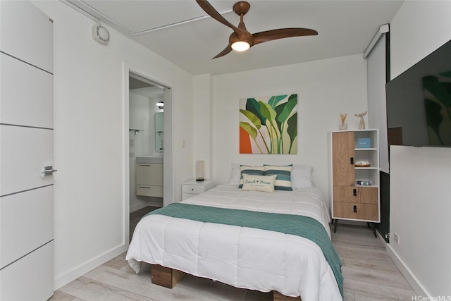 320 Liliuokalani Ave Unit 602, Honolulu, HI 96815 - bedroom featuring wood finished floors, ensuite bath, and ceiling fan