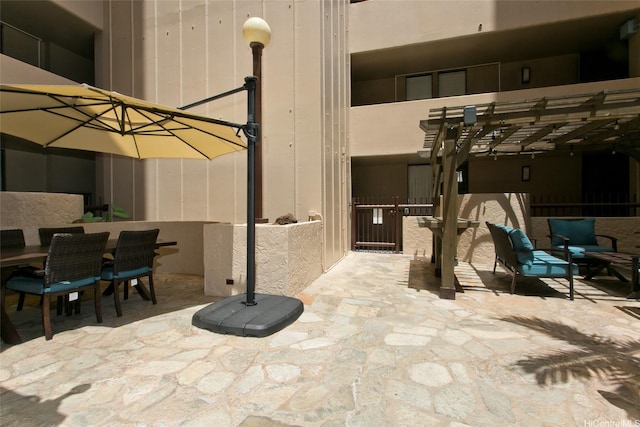 320 Liliuokalani Ave Unit 602, Honolulu, HI 96815 - view of patio / terrace with a pergola and outdoor dining area