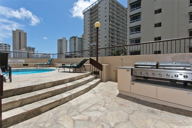 320 Liliuokalani Ave Unit 602, Honolulu, HI 96815 - view of patio / terrace featuring a city view and area for grilling