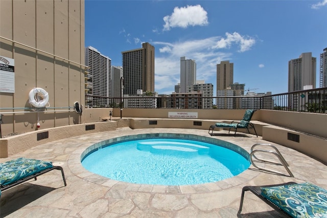 320 Liliuokalani Ave Unit 602, Honolulu, HI 96815 - view of swimming pool featuring a skyline view