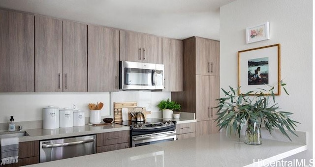 455 Kailua Rd Unit 4204, Kailua, HI 96734 - kitchen featuring stainless steel appliances, light countertops, and modern cabinets
