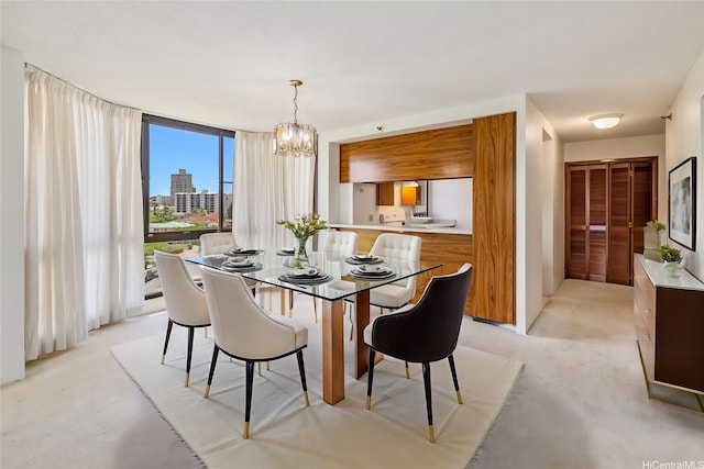 5090 Likini St Unit 501, Honolulu, HI 96818 - dining space featuring a chandelier, light colored carpet, and expansive windows