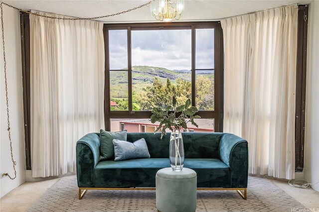 5090 Likini St Unit 501, Honolulu, HI 96818 - sitting room featuring carpet floors, a mountain view, and a chandelier
