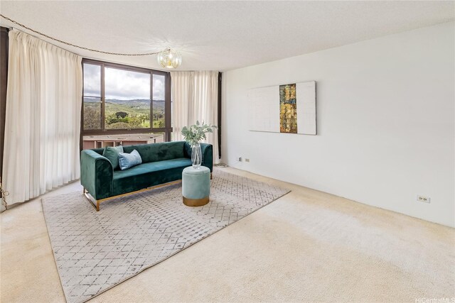 5090 Likini St Unit 501, Honolulu, HI 96818 - living area featuring carpet flooring and a chandelier