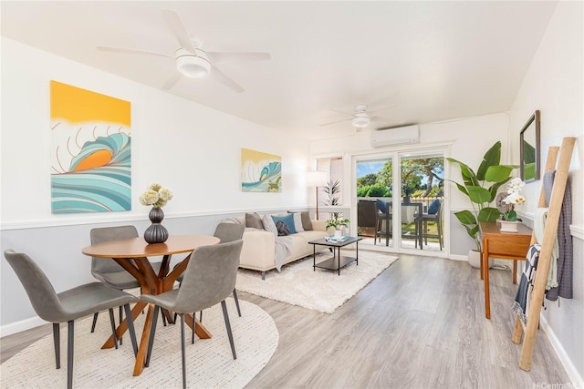 92-1163 Palahia St Unit E102, Kapolei, HI 96707 - dining room with a wall mounted AC, light wood finished floors, and a ceiling fan