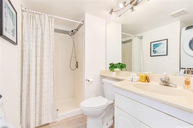 92-1163 Palahia St Unit E102, Kapolei, HI 96707 - bathroom with vanity, estacked washer and dryer, and tiled shower