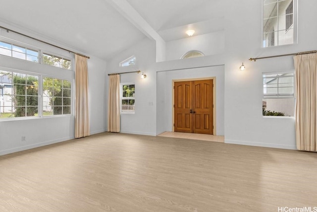 46-145 Humu Pl, Kaneohe, HI 96744 - foyer entrance featuring light wood-style flooring, healthy amount of natural light, high vaulted ceiling, and beamed ceiling