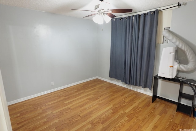 94-49 Waipahu St Unit 314, Waipahu, HI 96797 - spare room with a ceiling fan, light wood-style floors, and a textured ceiling