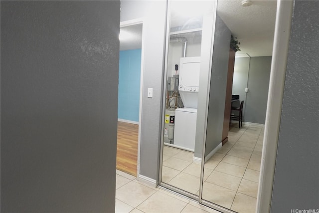 94-49 Waipahu St Unit 314, Waipahu, HI 96797 - hall featuring stacked washer / drying machine and light tile patterned flooring