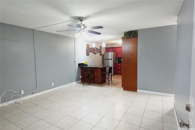 94-49 Waipahu St Unit 314, Waipahu, HI 96797 - living area featuring ceiling fan and a textured ceiling