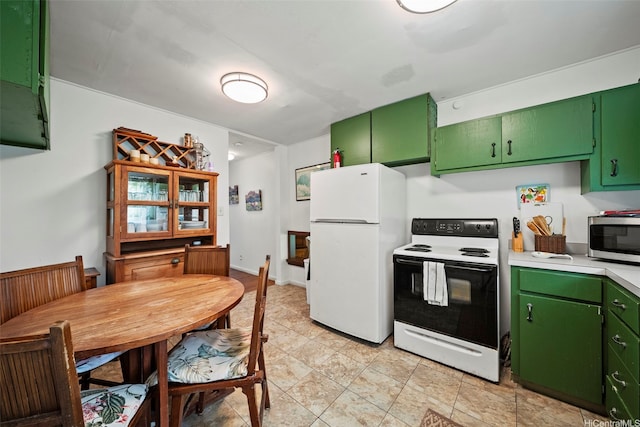 54-217 Kamehameha Hwy, Hauula, HI 96717 - kitchen with range with electric stovetop, freestanding refrigerator, stainless steel microwave, green cabinetry, and light countertops