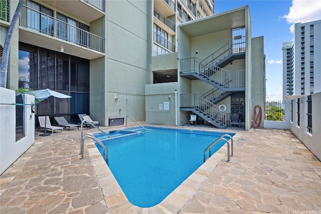 1561 Pensacola St Unit 1104, Honolulu, HI 96822 - community pool with stairs and a patio