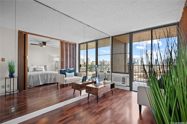 1561 Pensacola St Unit 1104, Honolulu, HI 96822 - bedroom with expansive windows, wood finished floors, a textured ceiling, access to exterior, and a city view