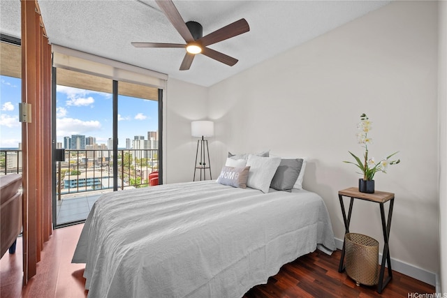 1561 Pensacola St Unit 1104, Honolulu, HI 96822 - bedroom featuring access to outside, wood finished floors, a view of skyline, and ceiling fan