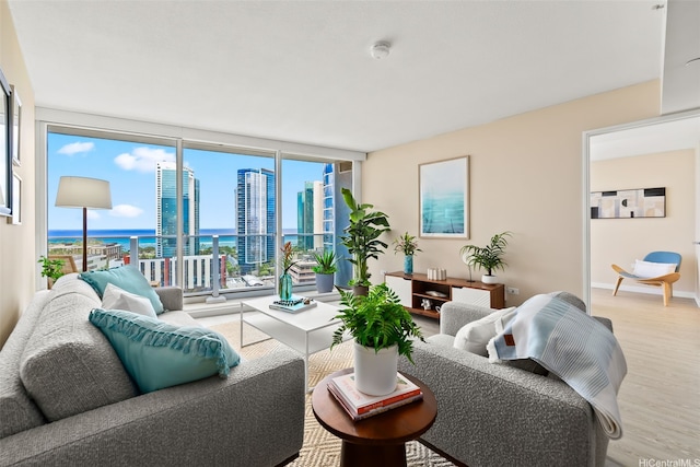 1296 Kapiolani Blvd Unit Ii2407, Honolulu, HI 96814 - living area with wood finished floors, floor to ceiling windows, and a water view