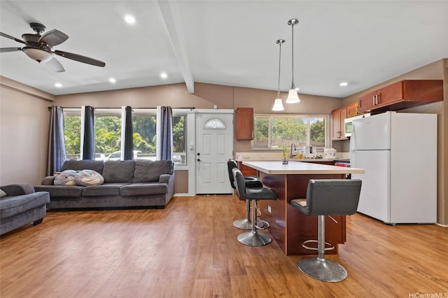 94-555 Awamoi St, Waipahu, HI 96797 - kitchen featuring freestanding refrigerator, light countertops, open floor plan, light wood-style floors, and recessed lighting