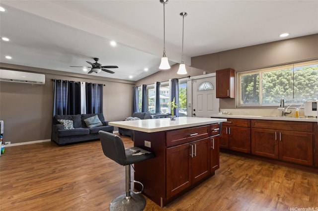 94-555 Awamoi St, Waipahu, HI 96797 - kitchen featuring a wall mounted air conditioner, lofted ceiling, light countertops, plenty of natural light, and dark wood-style floors