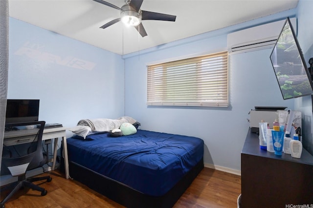 94-555 Awamoi St, Waipahu, HI 96797 - bedroom with a wall mounted air conditioner, wood finished floors, and ceiling fan