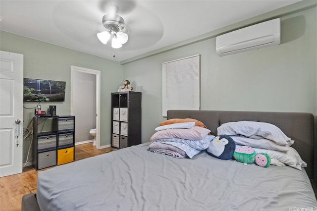 94-555 Awamoi St, Waipahu, HI 96797 - bedroom featuring an AC wall unit, wood finished floors, and a ceiling fan