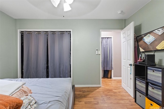 94-555 Awamoi St, Waipahu, HI 96797 - bedroom with light wood-style flooring and a ceiling fan