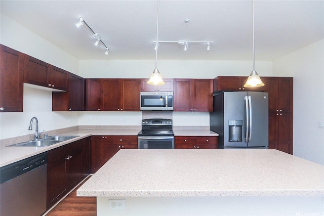 1020 Kakala St Unit 816, Kapolei, HI 96707 - kitchen with stainless steel appliances, track lighting, a center island, and decorative light fixtures