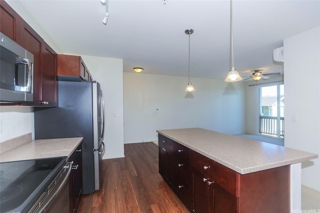 1020 Kakala St Unit 816, Kapolei, HI 96707 - kitchen with appliances with stainless steel finishes, a kitchen island, dark wood-style flooring, pendant lighting, and light countertops