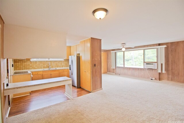 2410 Halenoho Pl, Honolulu, HI 96816 - kitchen with fridge with ice dispenser, light colored carpet, light countertops, backsplash, and a ceiling fan