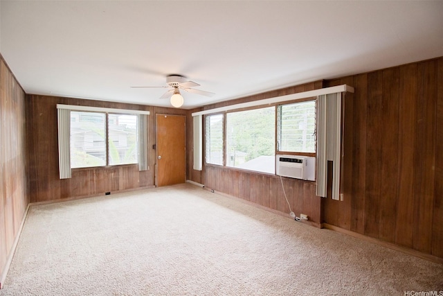 2410 Halenoho Pl, Honolulu, HI 96816 - carpeted spare room with wooden walls, cooling unit, healthy amount of natural light, and a ceiling fan